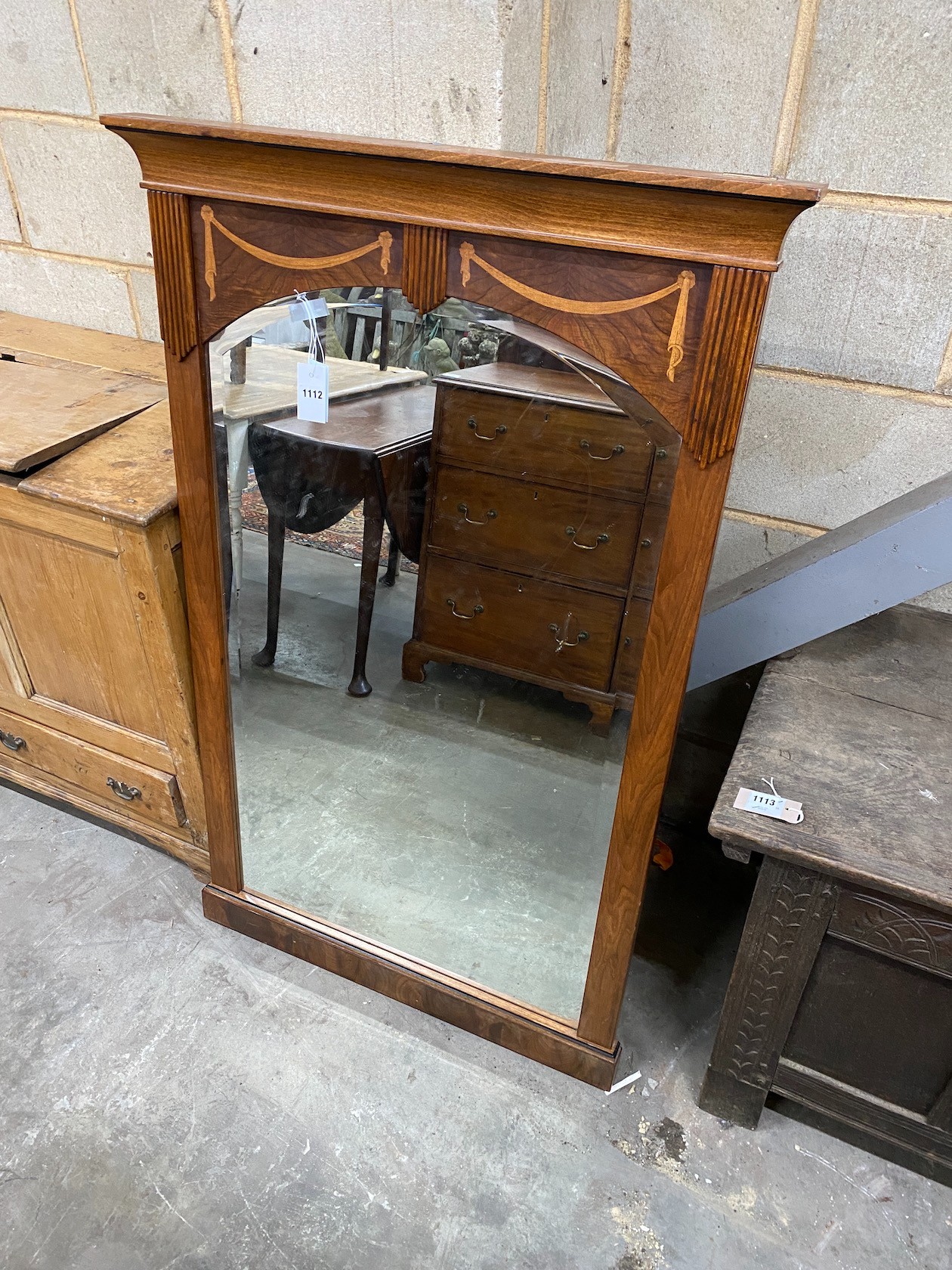 A Spanish inlaid walnut wall mirror, width 80cm height 128cm, and a later Asian carved and pierced wood wall mirror, width 79cm height 106cm